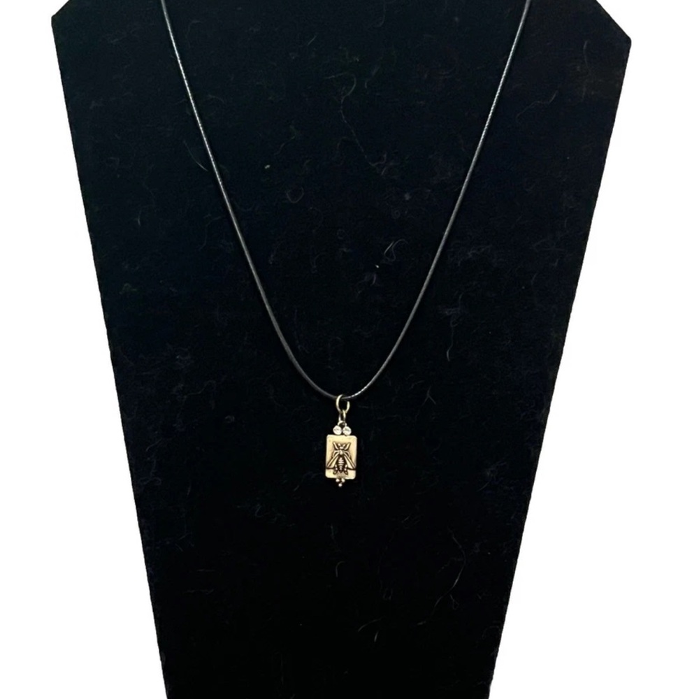 Gold Toned tarot card pendant With Bee On Black Leather Cord